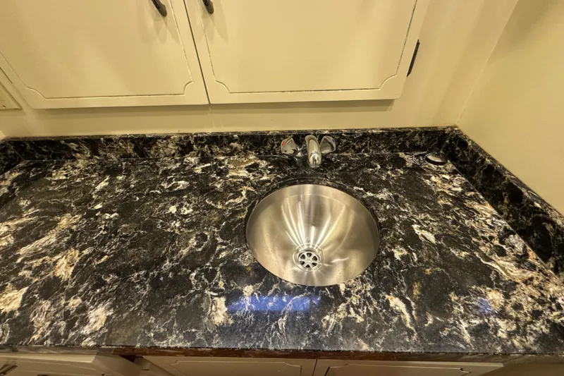 Slide: The Image of Marble countertop with stainless steel sink in 1974 Tollycraft 40 Tri-Cabin MY. - 17