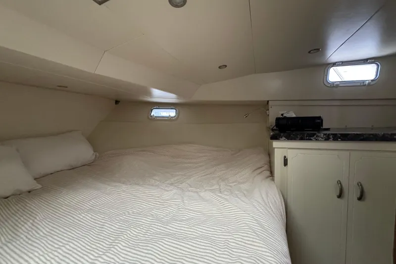 Slide: The Image of Cozy cabin interior of 1974 Tollycraft 40 Tri-Cabin MY with bed and storage. - 20