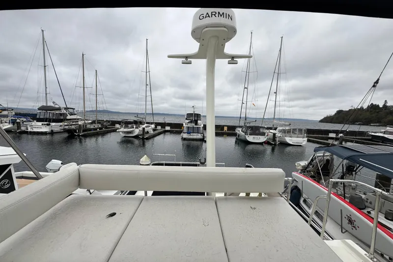 Slide: The Image of 1974 Tollycraft 40 Tri-Cabin MY at marina with sailboats and overcast sky. - 21