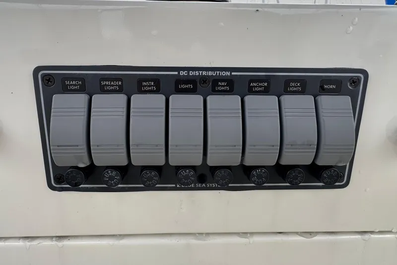 Slide: The Image of Control panel of a 1974 Tollycraft 40 Tri-Cabin MY with labeled switches for lights and horn. - 26