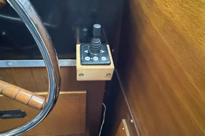 Slide: The Image of 1974 Tollycraft 40 Tri-Cabin MY helm with wooden steering wheel and control panel. - 36