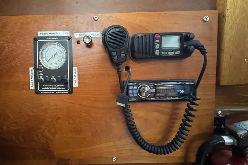 Slide: The Image of 1974 Tollycraft 40 Tri-Cabin MY control panel with radio and gauge instruments. - 38