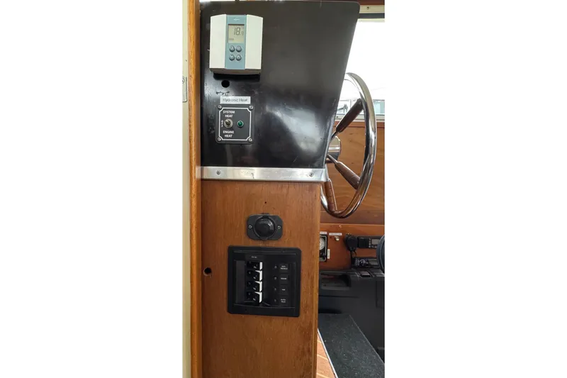 Slide: The Image of 1974 Tollycraft 40 Tri-Cabin MY helm with controls and steering wheel. - 40