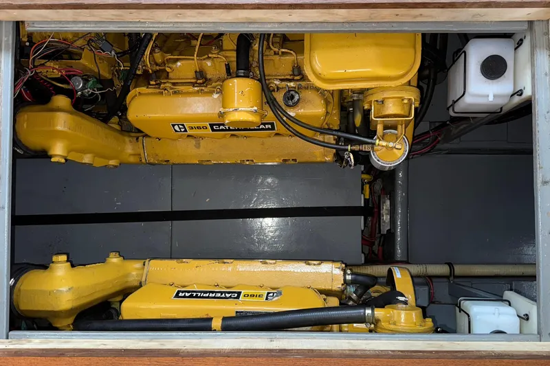 Slide: The Image of Engine compartment of 1974 Tollycraft 40 Tri-Cabin MY with Caterpillar 3160 engines. - 47