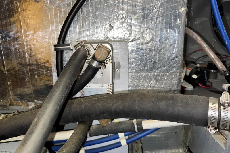 Slide: The Image of Engine room of 1974 Tollycraft 40 Tri-Cabin MY with hoses and fittings. - 48