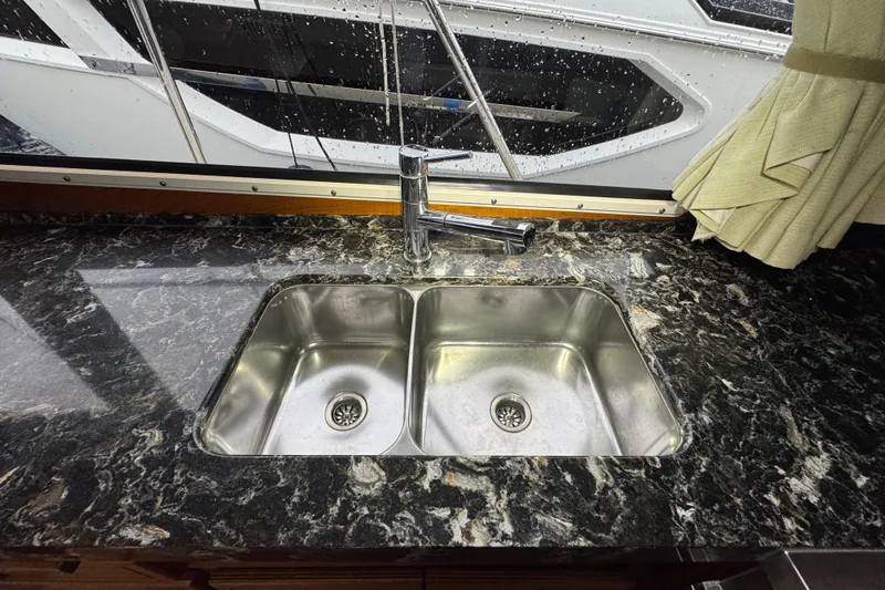 Slide: The Image of Stainless steel double sink on Tollycraft 40 Tri-Cabin MY, 1974, with marble countertop. - 49