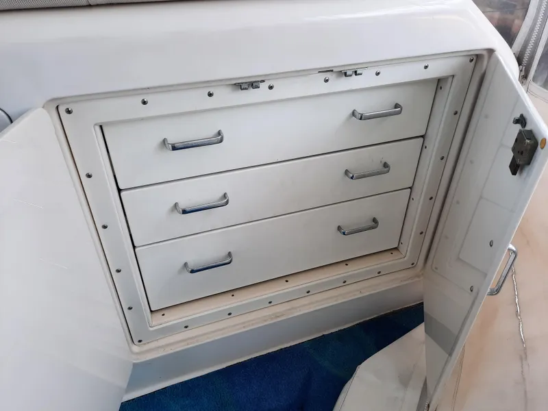 Slide: The Image of White drawers in Cabo 45 Express boat, year 2000. - 19