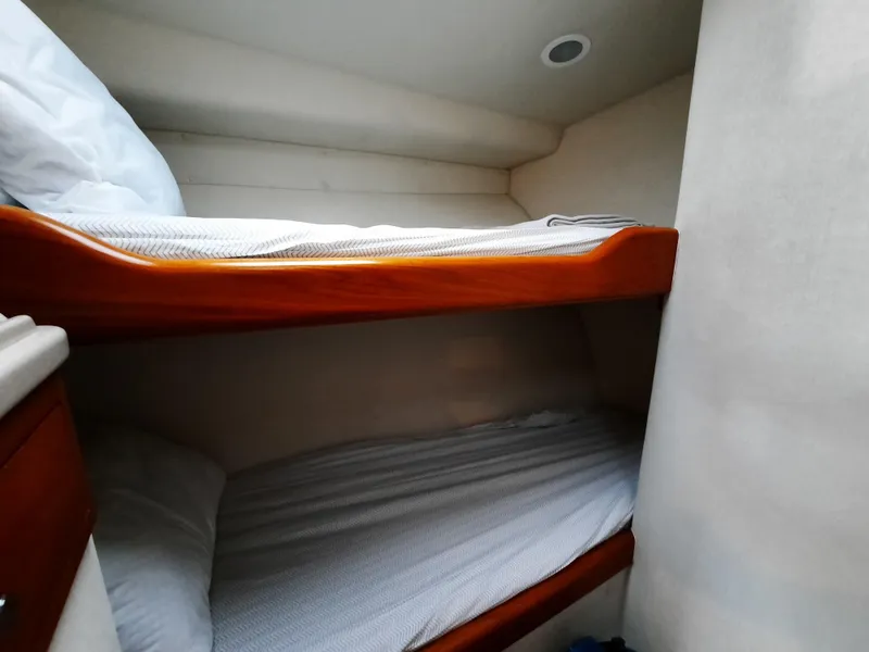 Slide: The Image of Bunk beds in a 2000 Cabo 45 Express yacht cabin. - 34