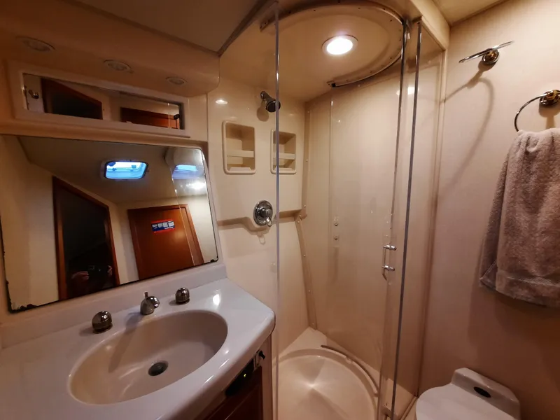 Slide: The Image of Cabo 45 Express 2000 bathroom with shower and sink. - 38
