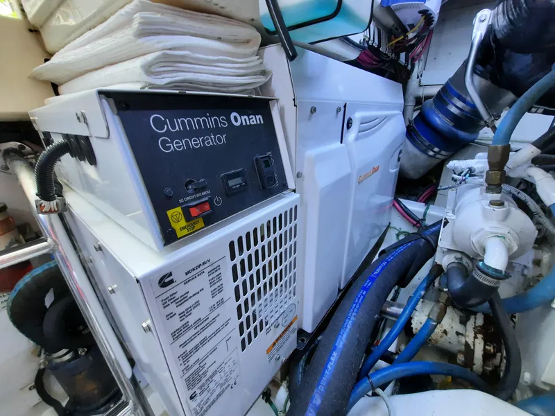 Slide: The Image of Cummins Onan generator in engine room of 2000 Cabo 45 Express. - 39