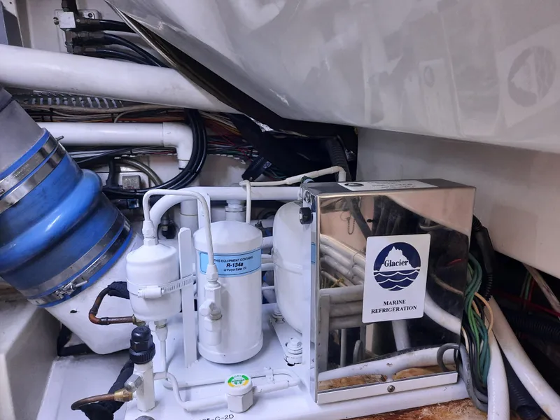 Slide: The Image of Engine room of Cabo 45 Express 2000 with cooling system. - 49