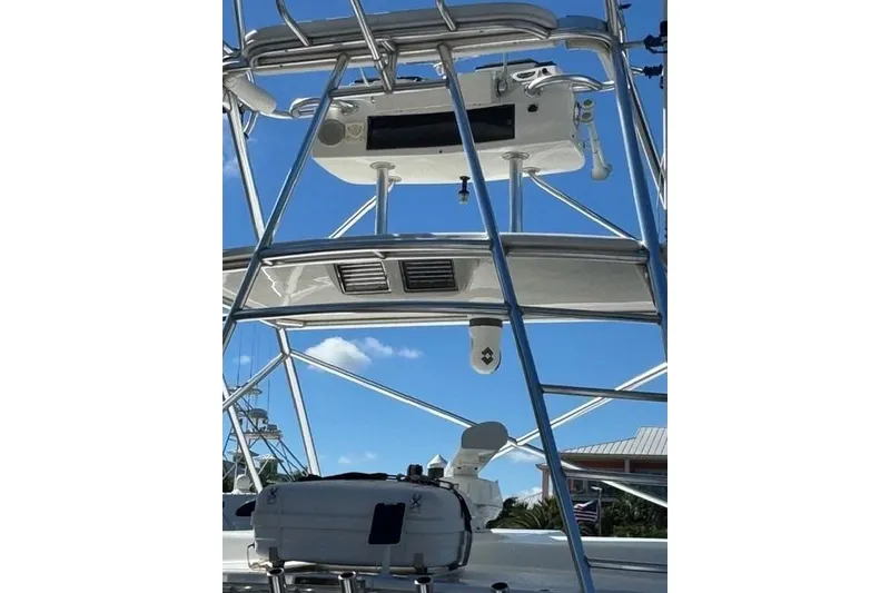 Slide: The Image of 2000 Cabo 45 Express boat tower with clear blue sky background. - 51