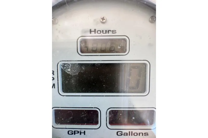 Slide: The Image of Hour meter display on a 2000 Cabo 45 Express boat dashboard. - 54