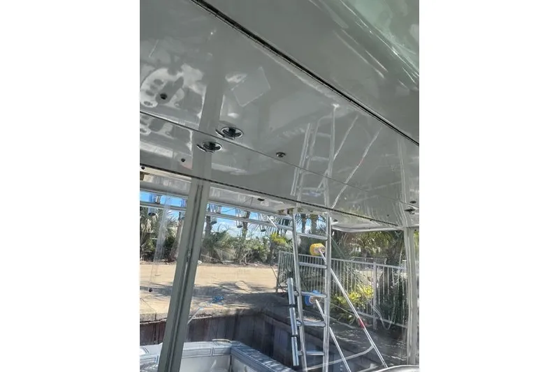 Slide: The Image of Interior view of a 2000 Cabo 45 Express boat with reflective ceiling. - 58