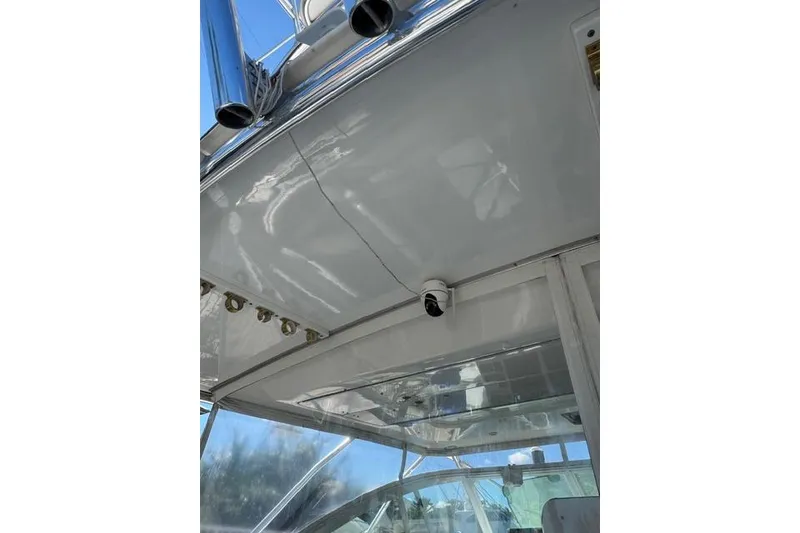 Slide: The Image of 2000 Cabo 45 Express boat interior with ceiling view and mounted camera. - 59