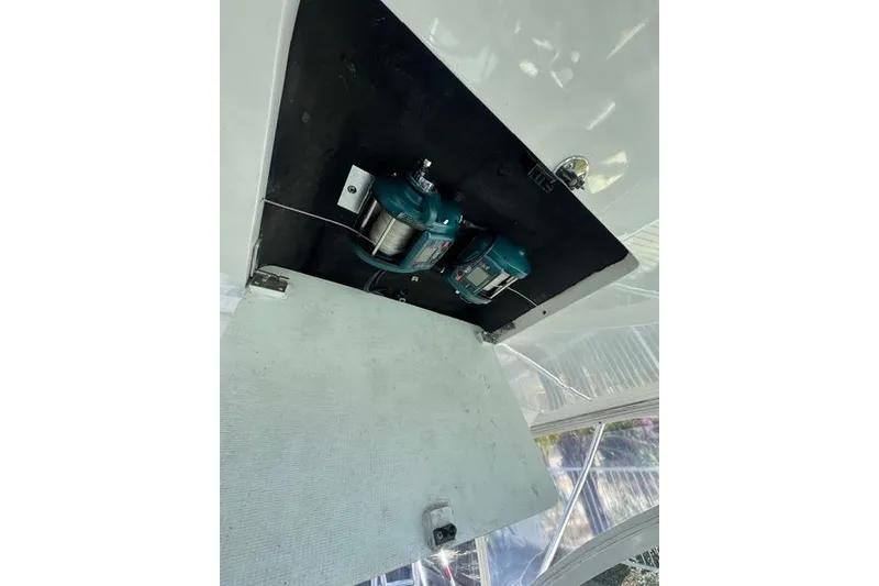 Slide: The Image of 2000 Cabo 45 Express boat compartment with electrical components. - 67