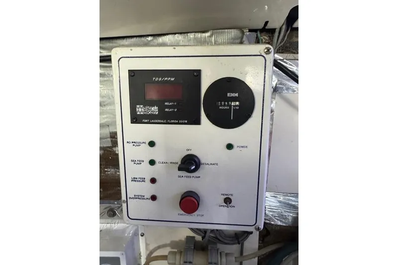 Slide: The Image of Control panel on a 2000 Cabo 45 Express boat, featuring various operational buttons and indicators. - 72