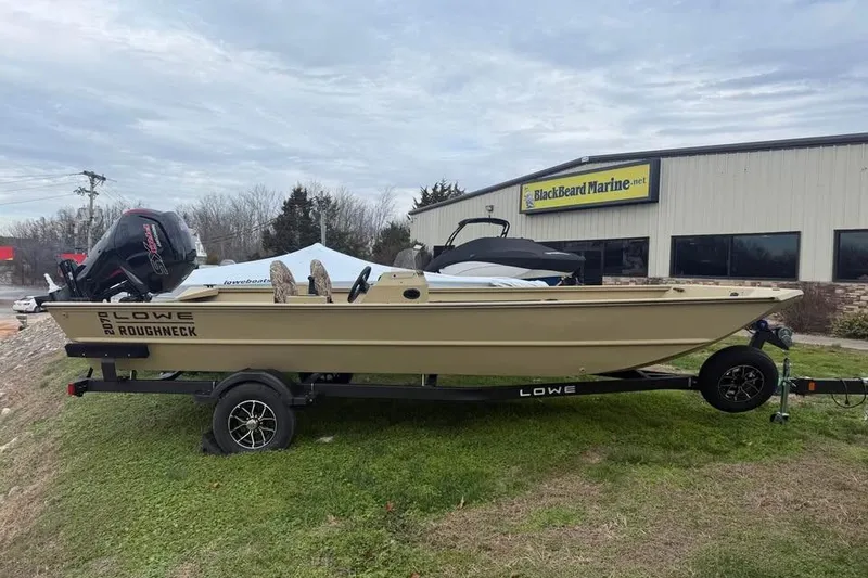 The Image of 2026 Lowe Roughneck 2070SC boat on trailer outside BlackBeard Marine dealership. - 0
