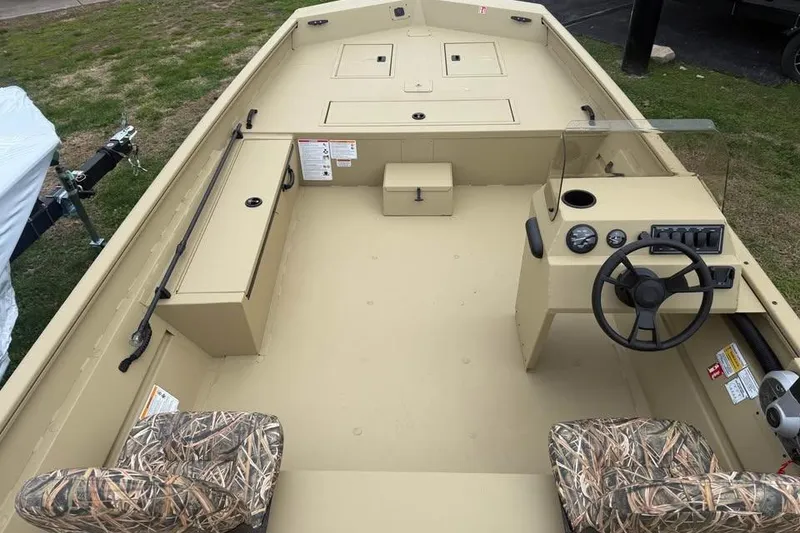 Slide: The Image of 2026 Lowe Roughneck 2070SC boat interior with camo seats and steering console. - 10
