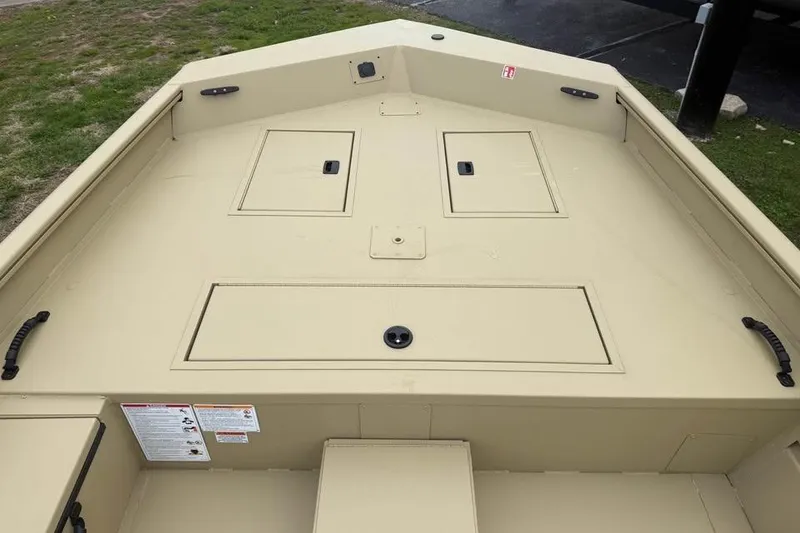 Slide: The Image of 2026 Lowe Roughneck 2070SC boat interior with storage compartments, beige finish. - 12