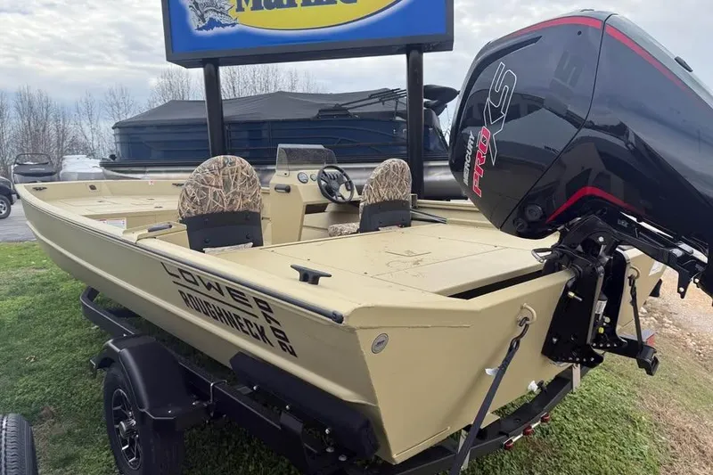 Slide: The Image of 2026 Lowe Roughneck 2070SC boat with Mercury Pro XS engine, parked on grass. - 5