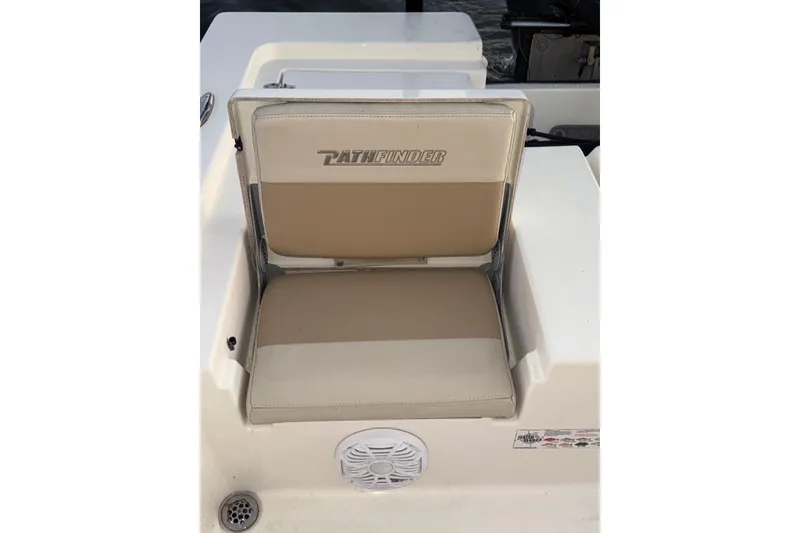 Slide: The Image of 2014 Pathfinder 2200 TRS boat seat with logo and speaker detail. - 10