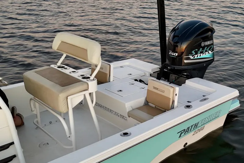 Slide: The Image of 2014 Pathfinder 2200 TRS boat with Yamaha engine on calm water. - 23