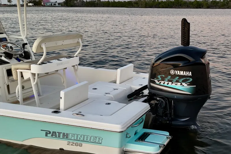Slide: The Image of 2014 Pathfinder 2200 TRS boat with Yamaha SHO VMAX engine on calm water. - 24