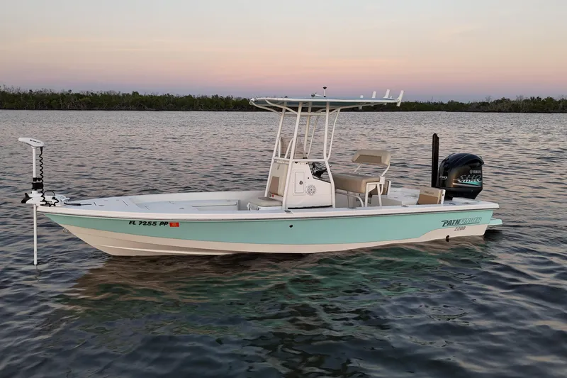 Slide: The Image of 2014 Pathfinder 2200 TRS boat on calm water at sunset. - 38