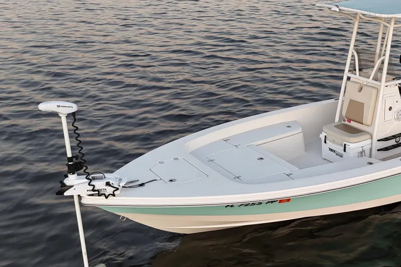 Slide: The Image of 2014 Pathfinder 2200 TRS boat with Minn Kota trolling motor on calm water. - 47