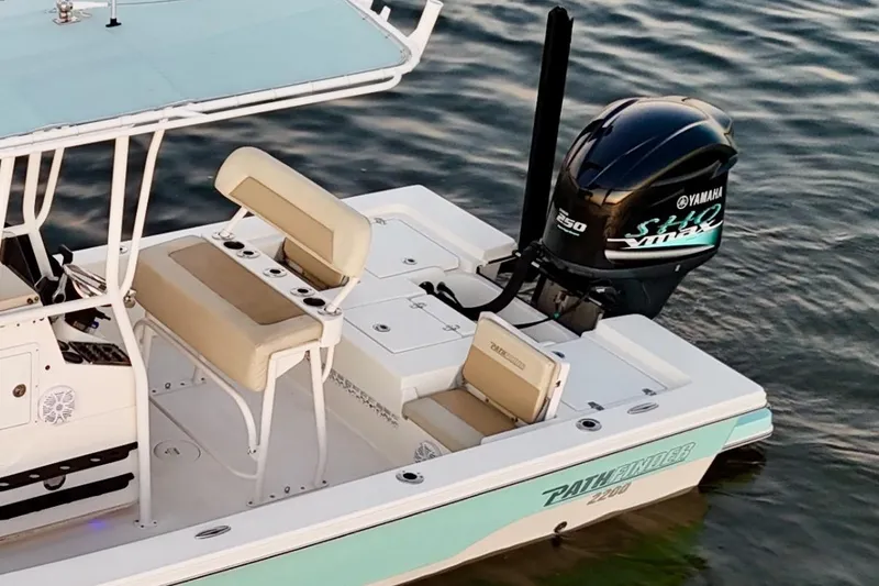 Slide: The Image of 2014 Pathfinder 2200 TRS boat with Yamaha engine on calm water. - 6
