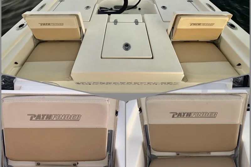 Slide: The Image of 2014 Pathfinder 2200 TRS boat seats with logo, beige upholstery, and storage compartments. - 8