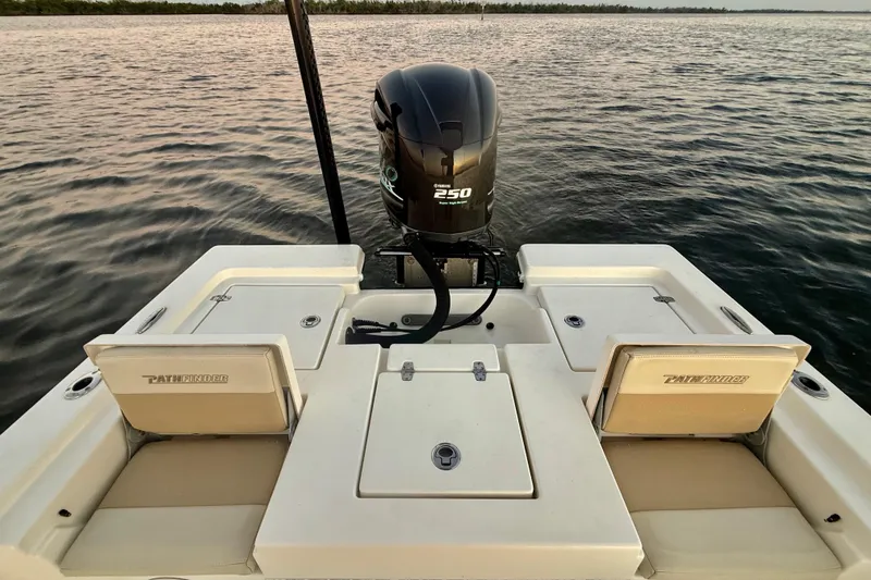 Slide: The Image of 2014 Pathfinder 2200 TRS boat with Yamaha 250 engine on calm water. - 9