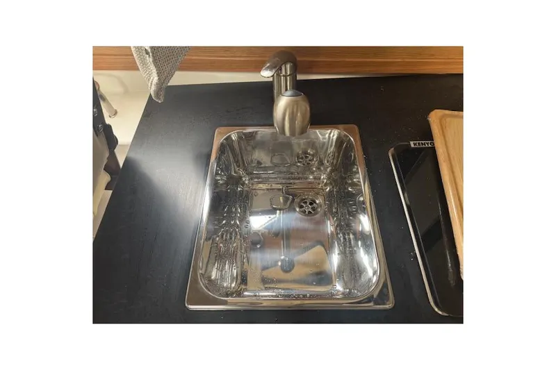 Slide: The Image of 2026 Cutwater C-248 Coupe helm with Garmin navigation and wooden steering wheel. - 11