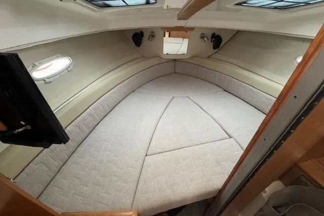 Slide: The Image of 2026 Cutwater C-248 Coupe kitchen with cutting board and induction cooktop. - 14