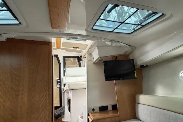 Slide: The Image of 2026 Cutwater C-248 Coupe bathroom with wooden cabinetry, stainless steel sink, and compact toilet. - 15