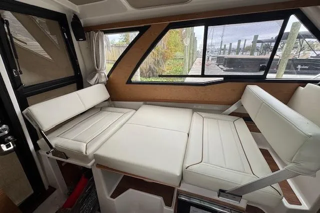 Slide: The Image of 2026 Cutwater C-248 Coupe interior with white seating and wood accents. - 18