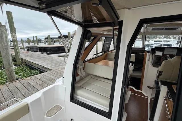 Slide: The Image of 2026 Cutwater C-248 Coupe interior with helm, seating, and modern amenities. - 30