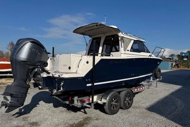Slide: The Image of 2026 Cutwater C-248 Coupe boat on trailer, featuring sleek design and powerful outboard motor. - 40