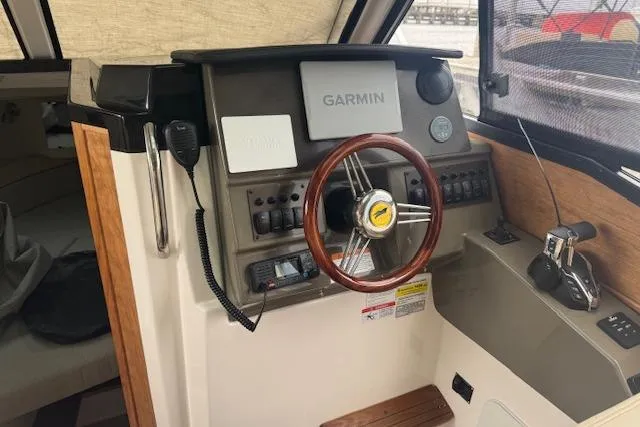 Slide: The Image of 2026 Cutwater C-248 Coupe boat on a lift at a marina. - 9