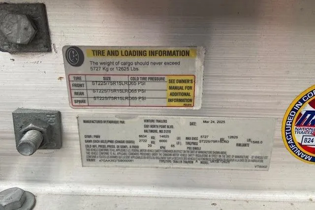 Slide: The Image of Tire and loading information label on a 2004 Regal Commodore 2860 boat trailer. - 15