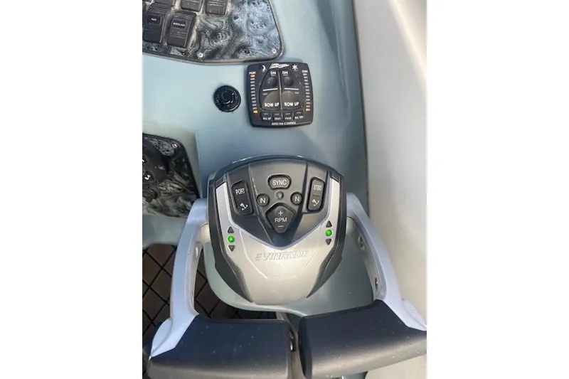 Slide: The Image of Control panel of a 2004 Regal Commodore 2860 boat with Evinrude throttle. - 7