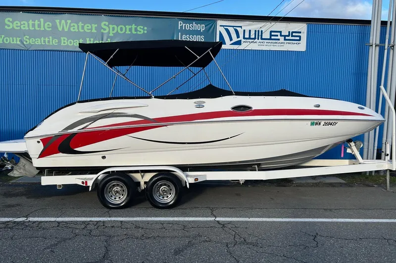 The Image of 2005 Chaparral Sunesta 252 boat on trailer, parked outside Seattle Water Sports. - 0