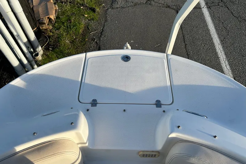 Slide: The Image of 2005 Chaparral Sunesta 252 boat deck, white surface, outdoor setting. - 13