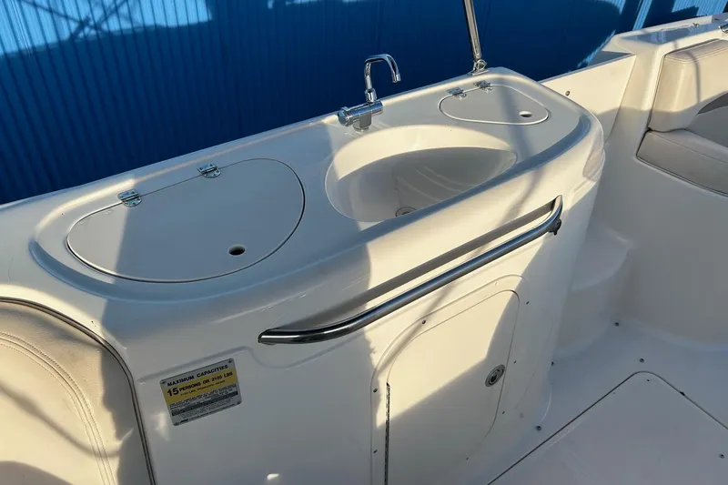 Slide: The Image of 2005 Chaparral Sunesta 252 boat interior with sink and storage area. - 20