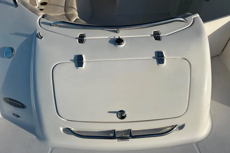 Slide: The Image of 2005 Chaparral Sunesta 252 boat deck with storage compartment and seating area. - 25