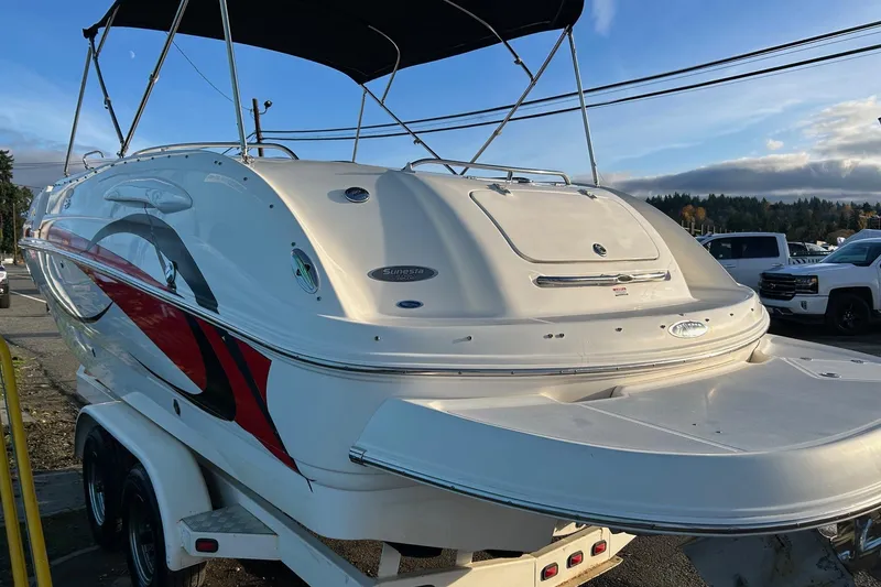 Slide: The Image of 2005 Chaparral Sunesta 252 boat on trailer, featuring sleek design and vibrant graphics. - 26