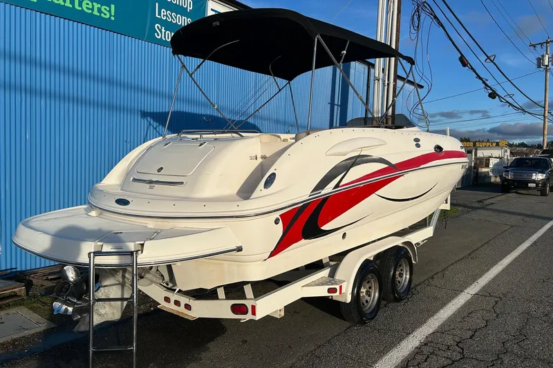 Slide: The Image of 2005 Chaparral Sunesta 252 boat on trailer, featuring sleek design and vibrant graphics. - 3