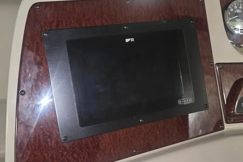 Slide: The Image of Dashboard of a 2012 Sea Ray 370 Sundancer boat with a digital display. - 12