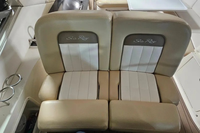 Slide: The Image of Beige leather seats on a 2012 Sea Ray 370 Sundancer boat interior. - 15